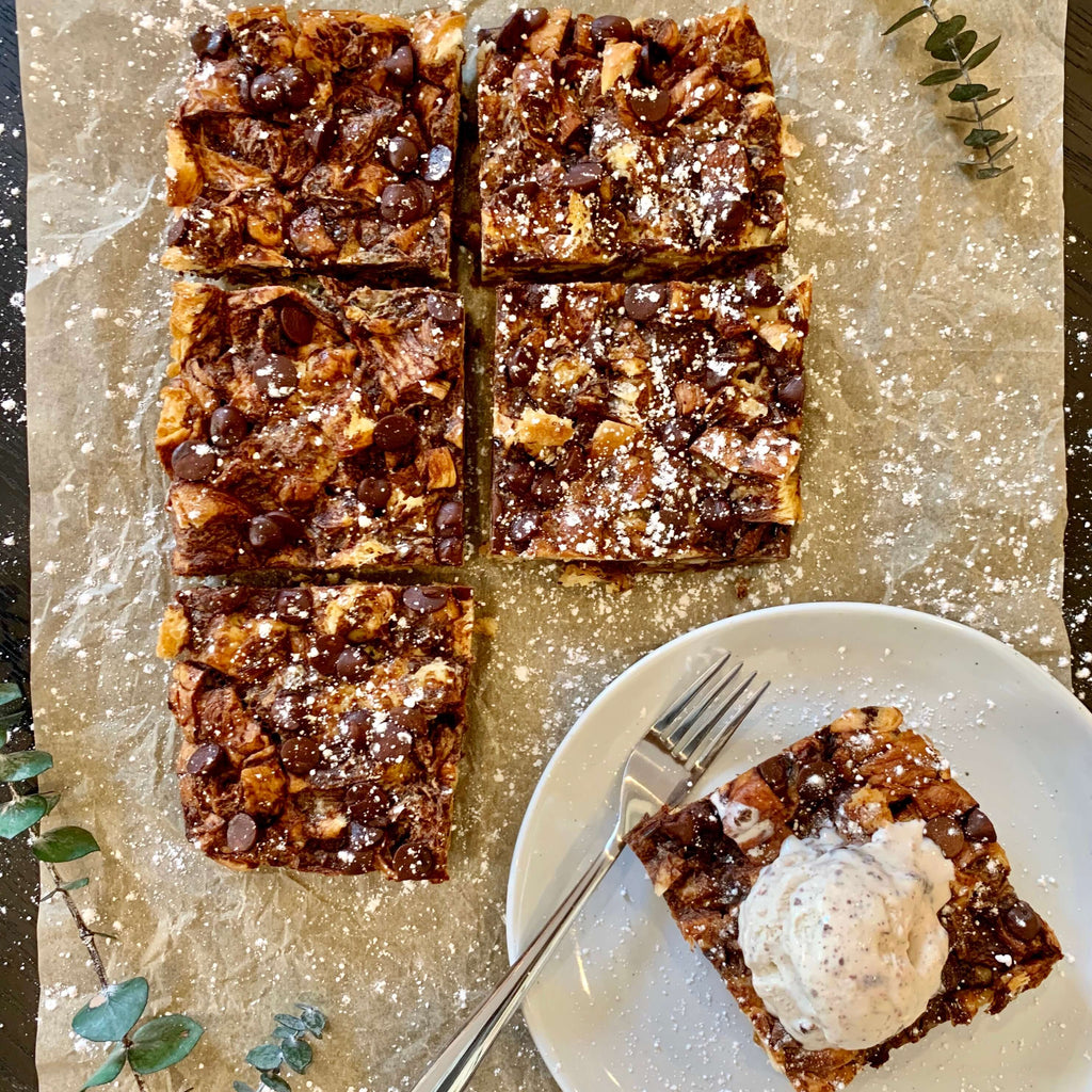 chocolate croissant bar served with whip cream on top